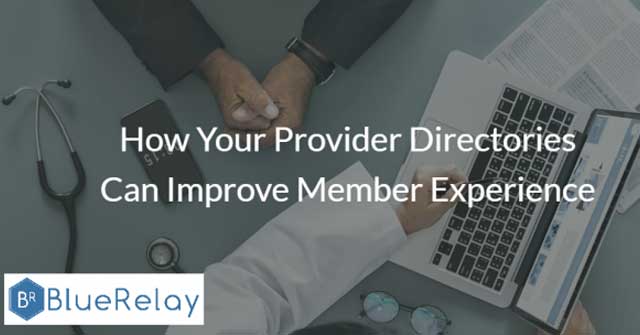 Photo of the top of a blue desk with two people sitting on either side, only their arms past the elbow are visible. One has a black blazer, and the other has a white doctor's lab coat pointing to something on a laptop screen that is facing towards the other person. There is also a stethoscope, mobile phone, and a pair of glasses on the desk