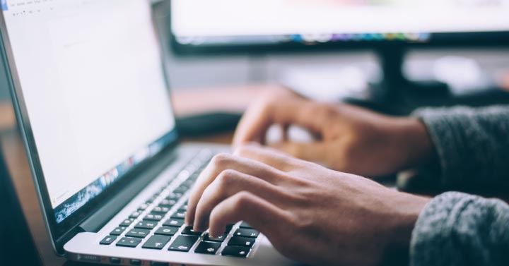 hands working at computer