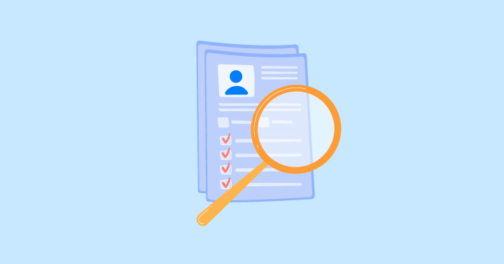 A magnifying glass on a document with a persons face