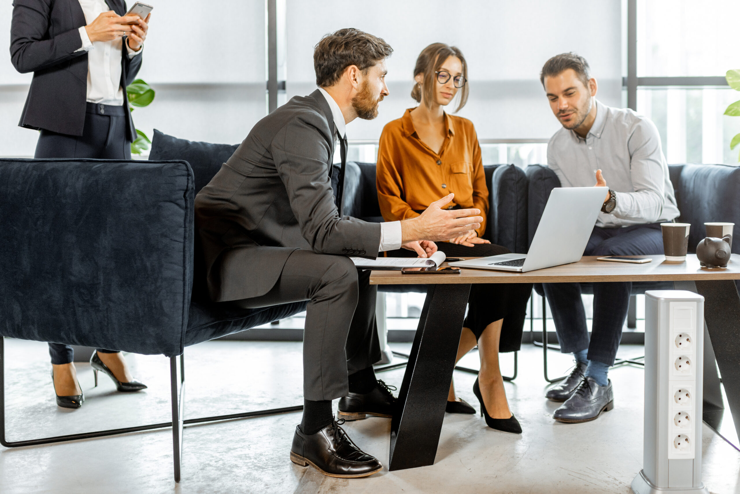 Young couple with financial advisor at the office